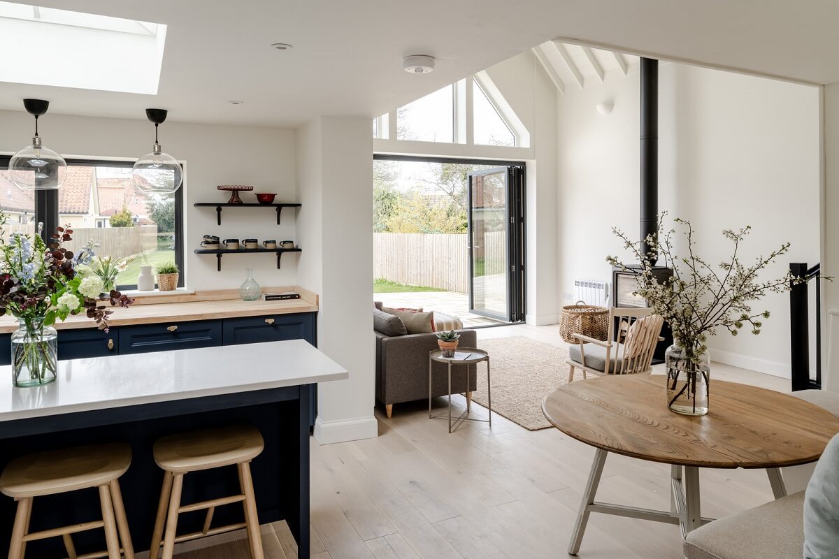 open plan living space with round dining table