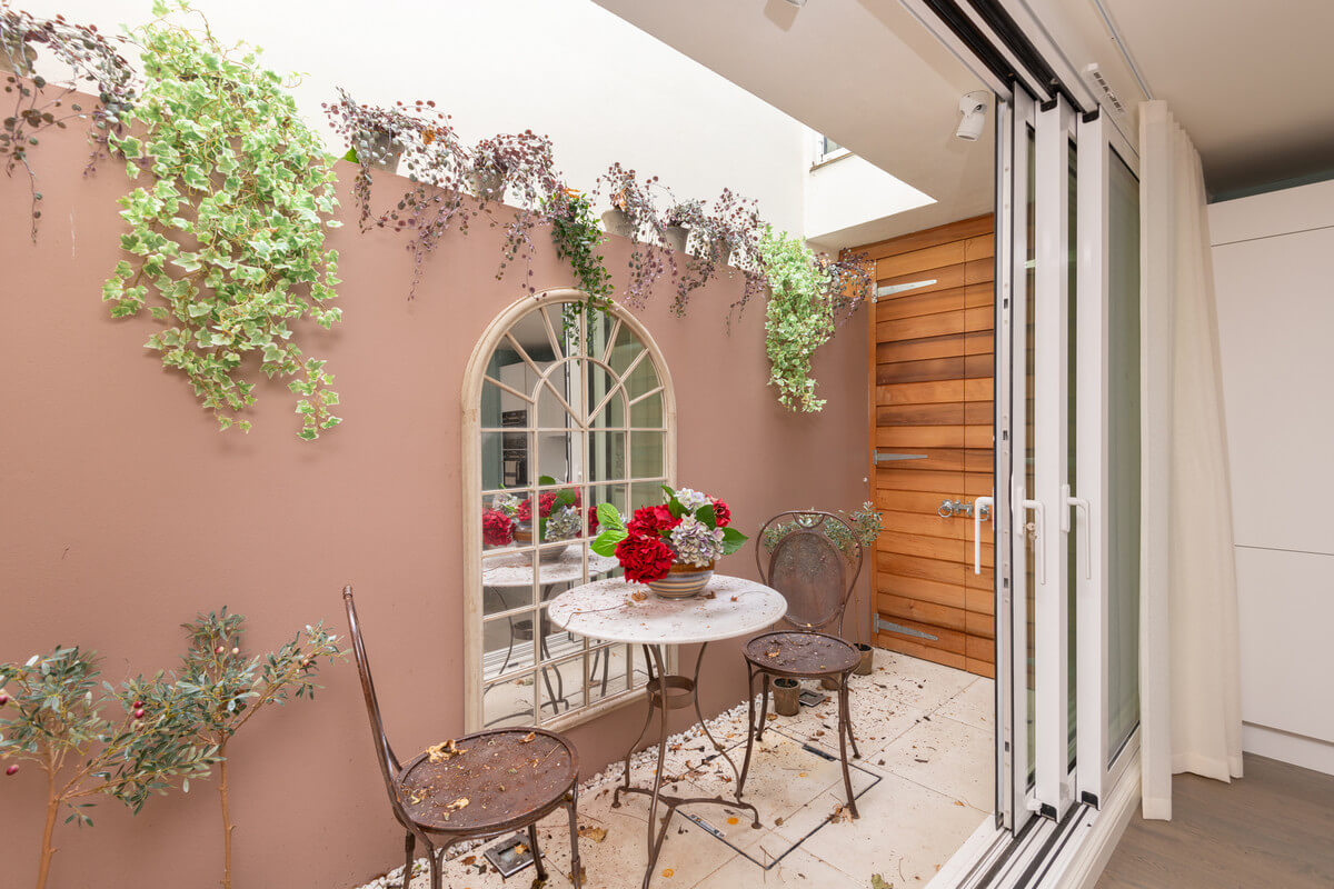 A Light London Maisonette in a Former Artist's Studio 12 patio with pink wall