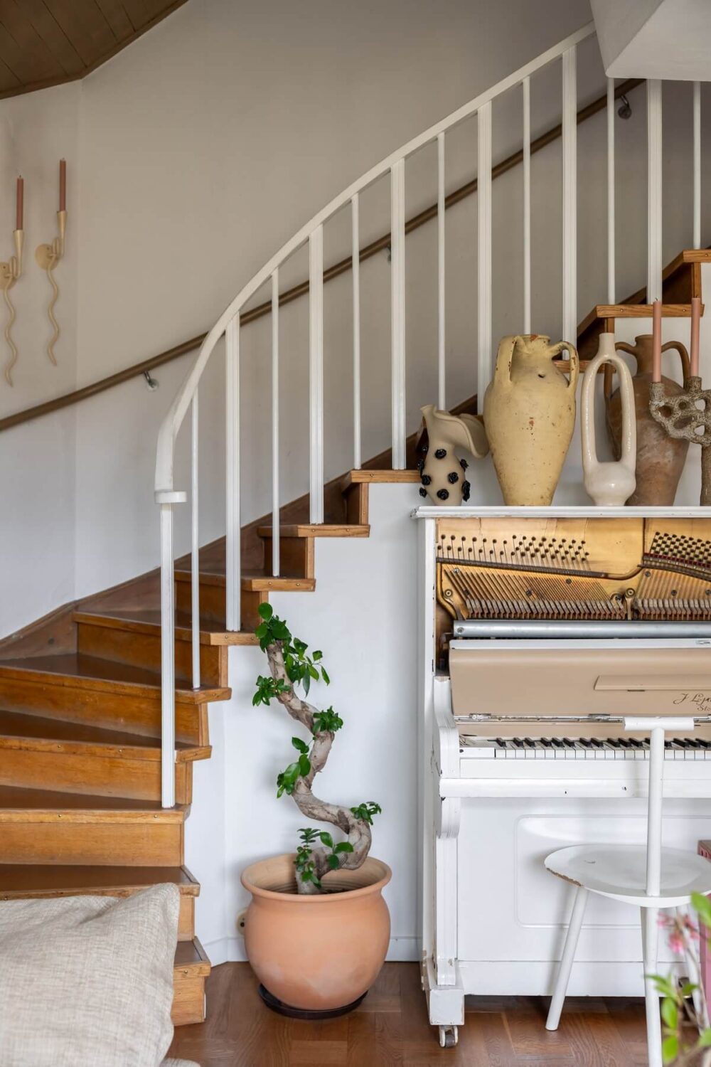 A Swedish Family House with Wall Murals and Art 5 piano and staircase