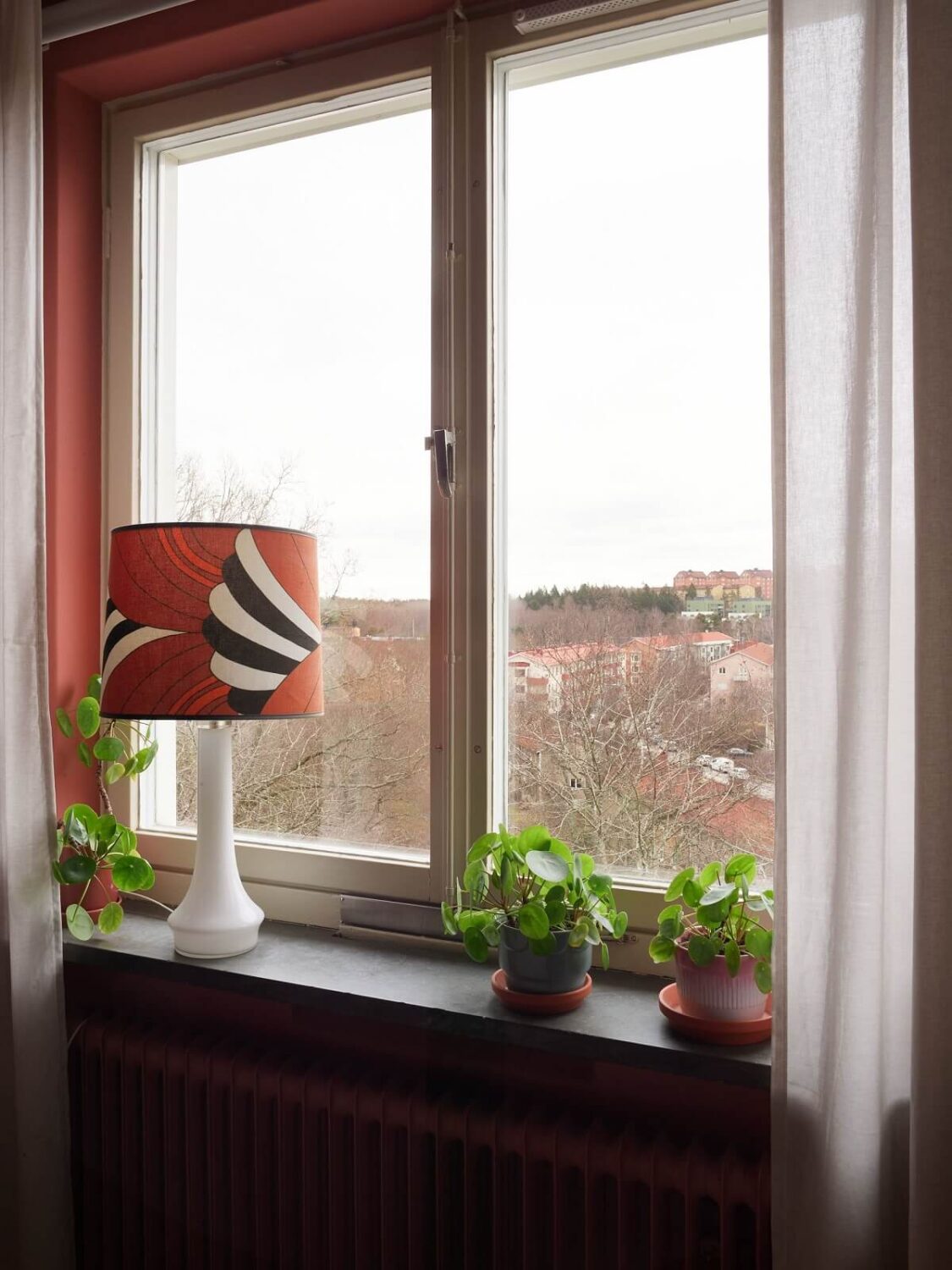 Revisiting a Small Green and Pink Midcentury Apartment 16 pink bedroom window