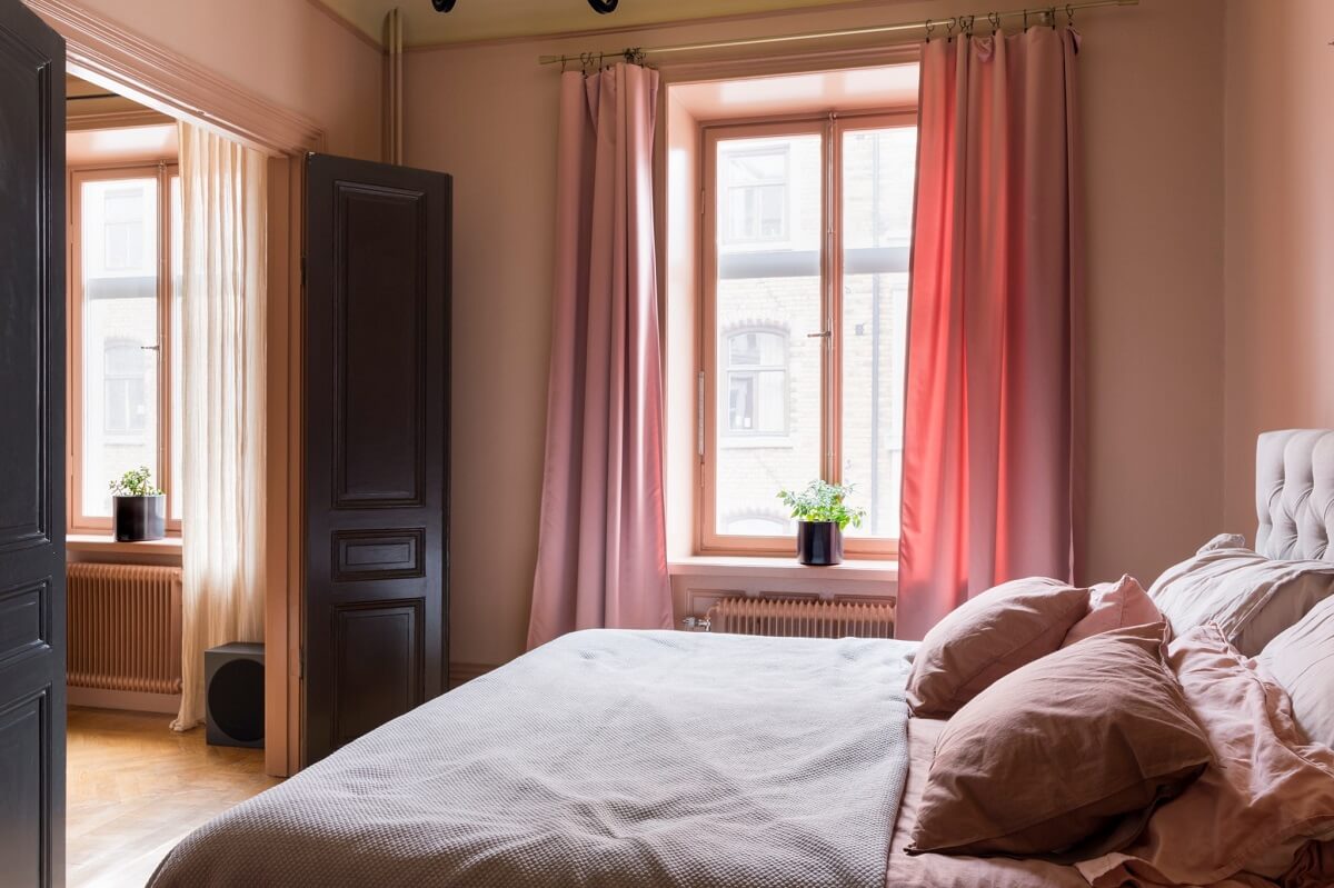 A Pink Apartment with a Black Kitchen 12 pink bedroom with black doors