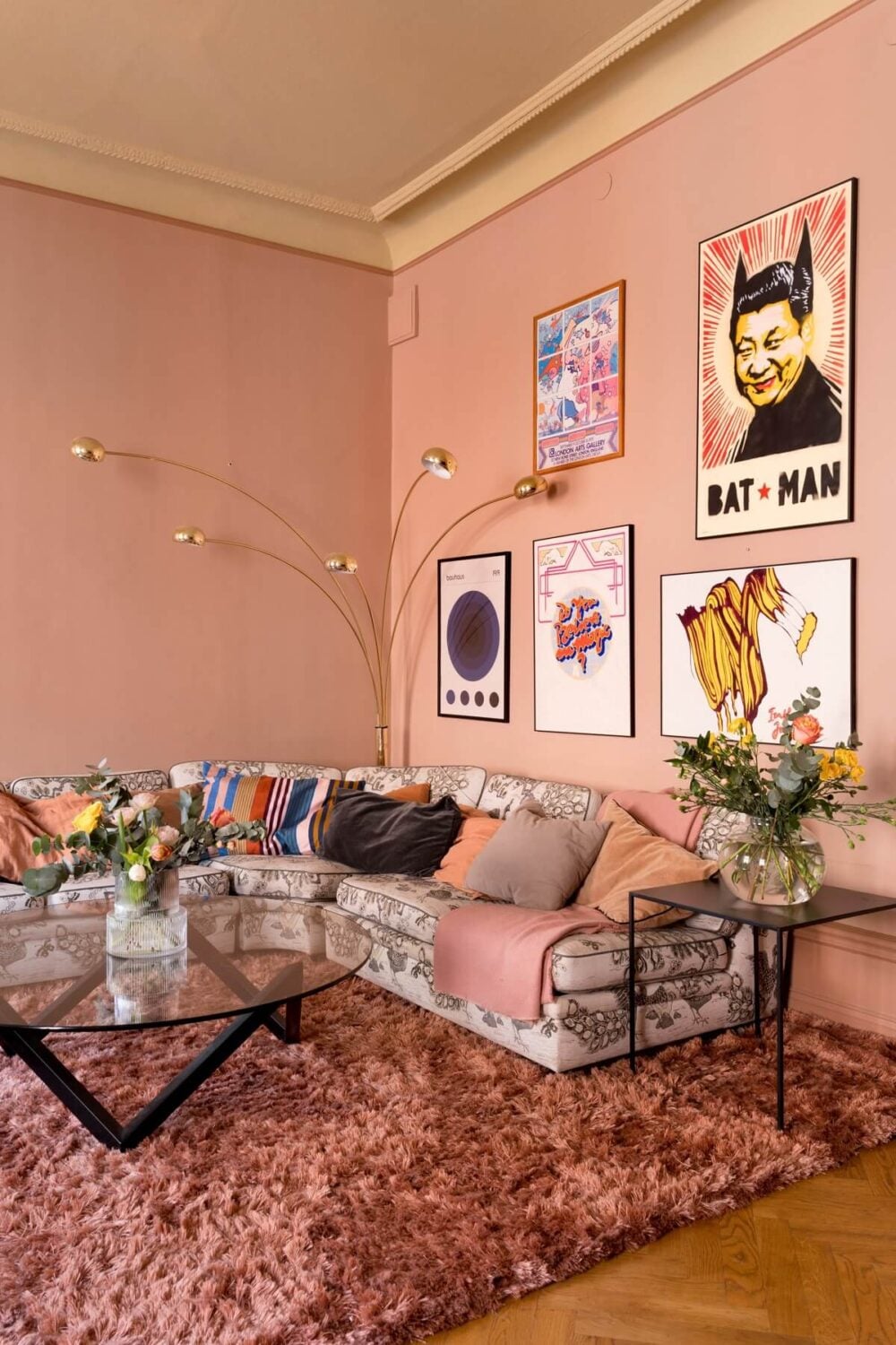 A Pink Apartment with a Black Kitchen 3 pink living room with art and floral sofa nordroom