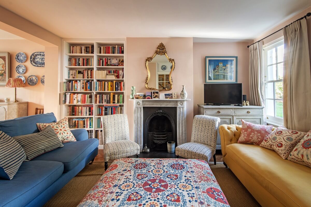 A Colorful Neo-Georgian House in London 2 pink living room with fireplace and yellow sofa