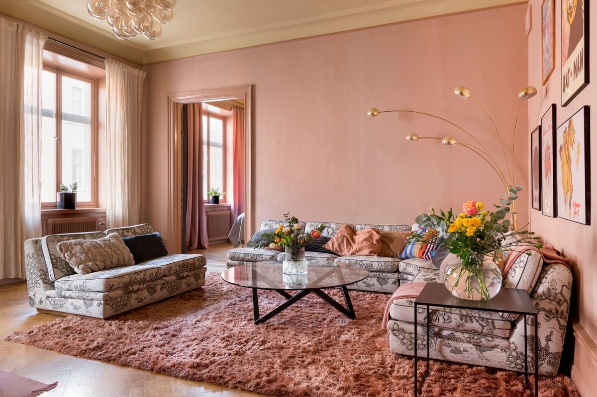 A Pink Apartment with a Black Kitchen 2 pink living room with large cozy rug