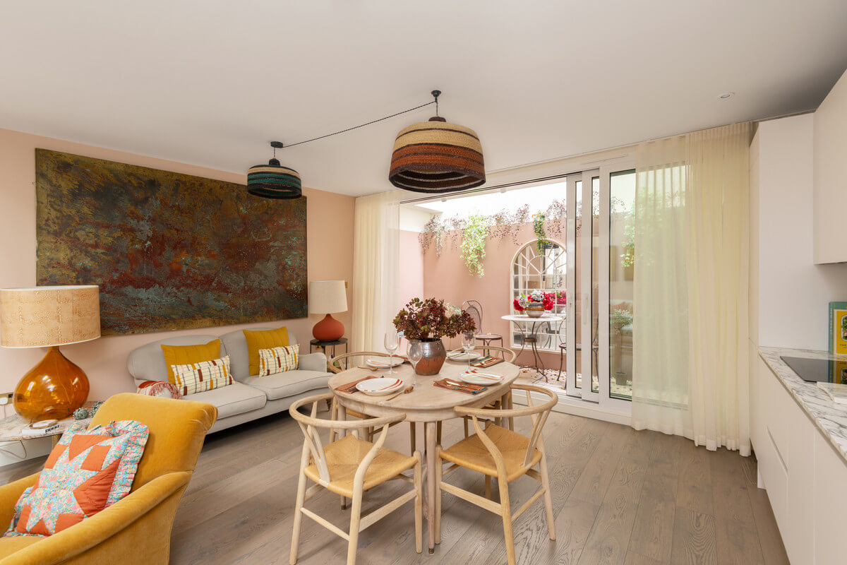 A Light London Maisonette in a Former Artist's Studio 11 pink walls kitchen space with round table