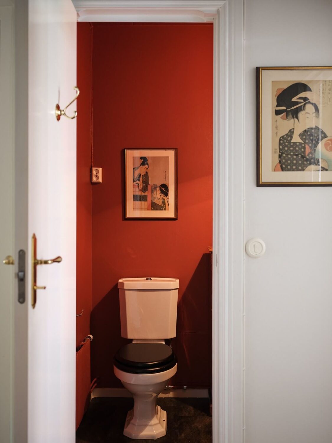 A Classic Stockholm Apartment with Floral Wallpaper 31 powder room with red walls nordroom