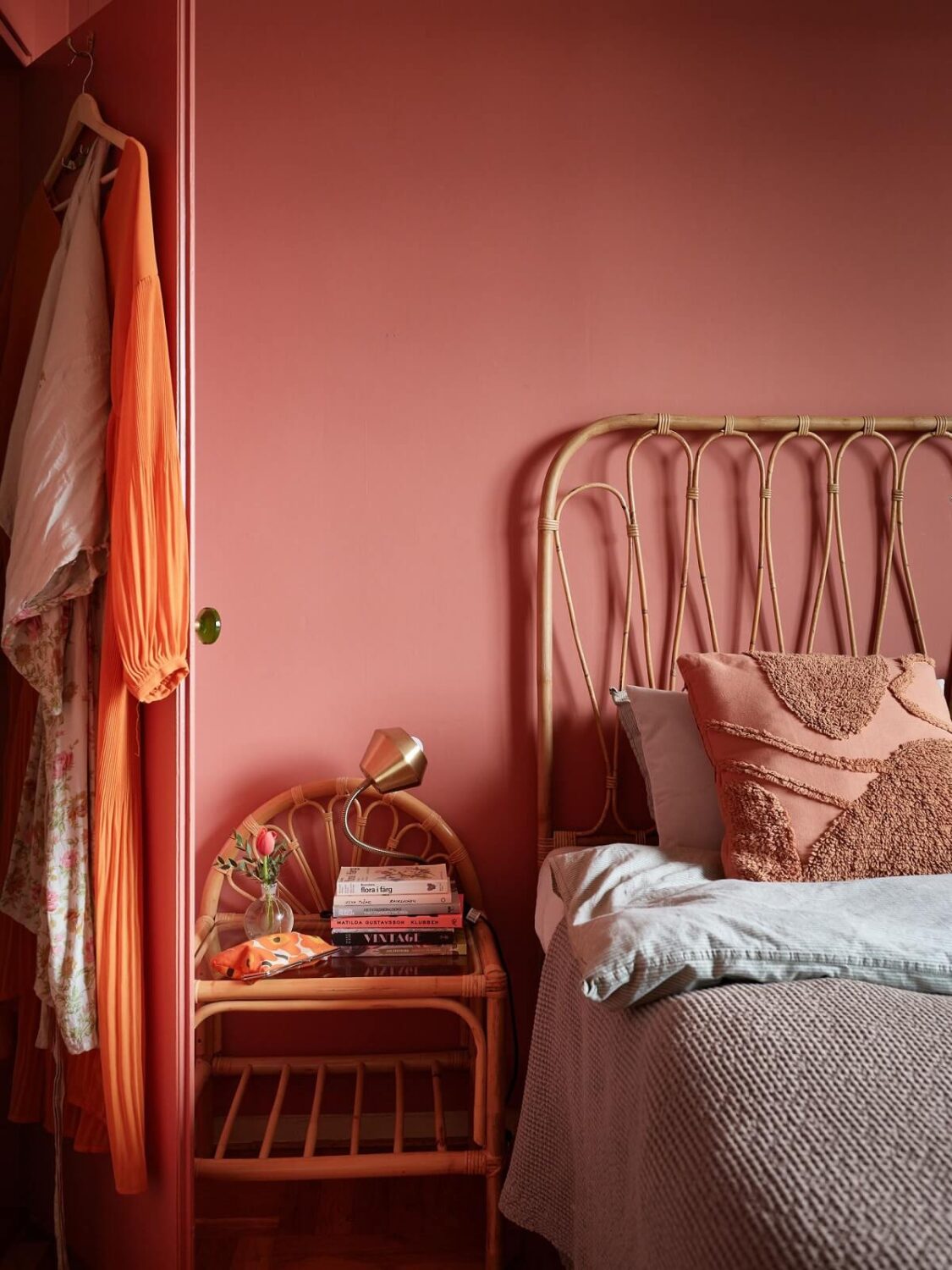 Revisiting a Small Green and Pink Midcentury Apartment 18 rattan headboard and night stand