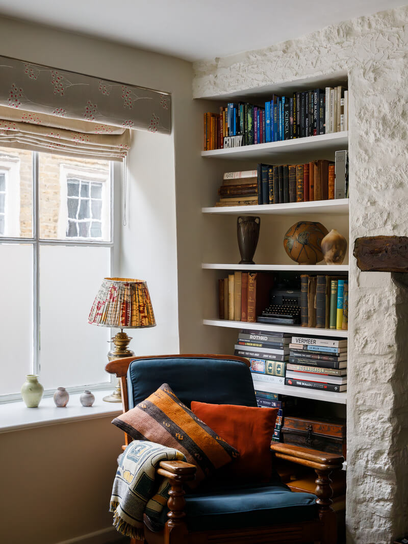 A Charming English Cottage Filled with Historic Character 3 reading nook with blue chair