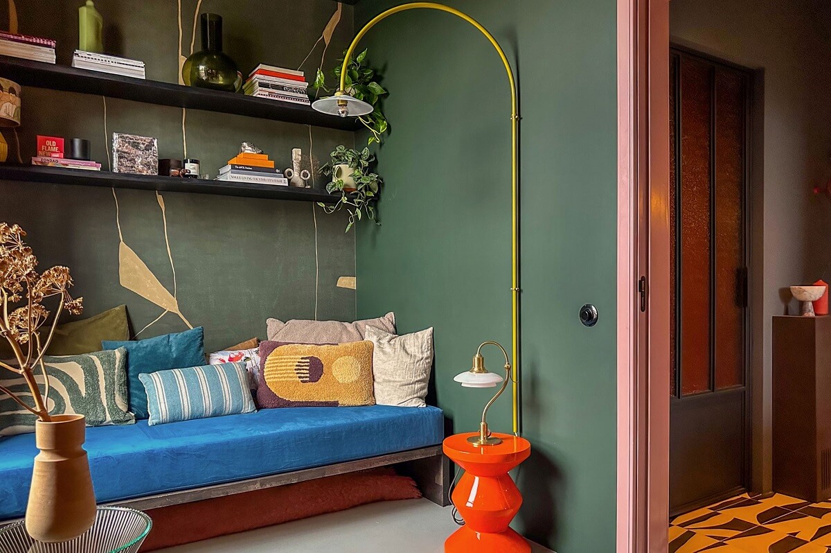 Color and Graphic Design in the Home of a Dutch Interior Stylist 35 reading nook with shelves