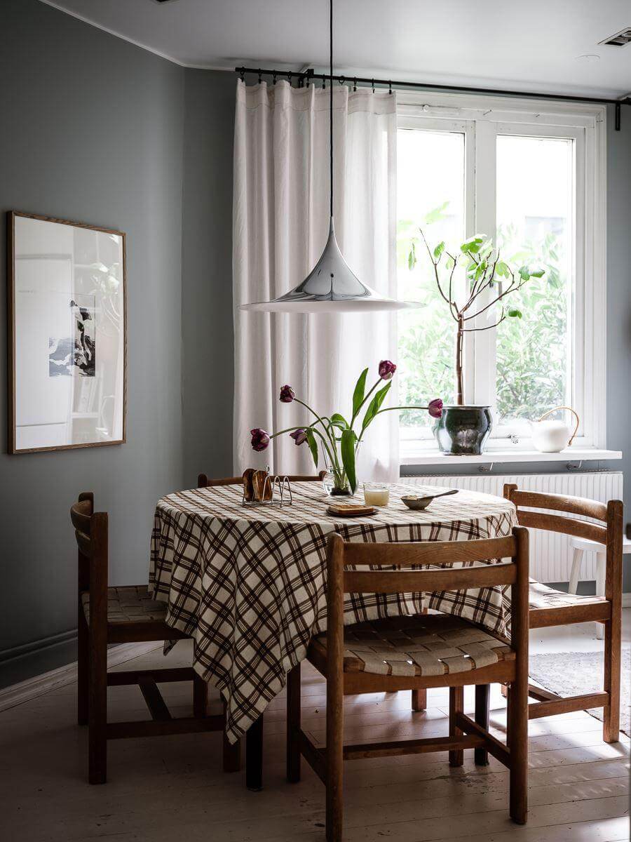 A Scandinavian Apartment with a Rust Red Bedroom 10 round kitchen table