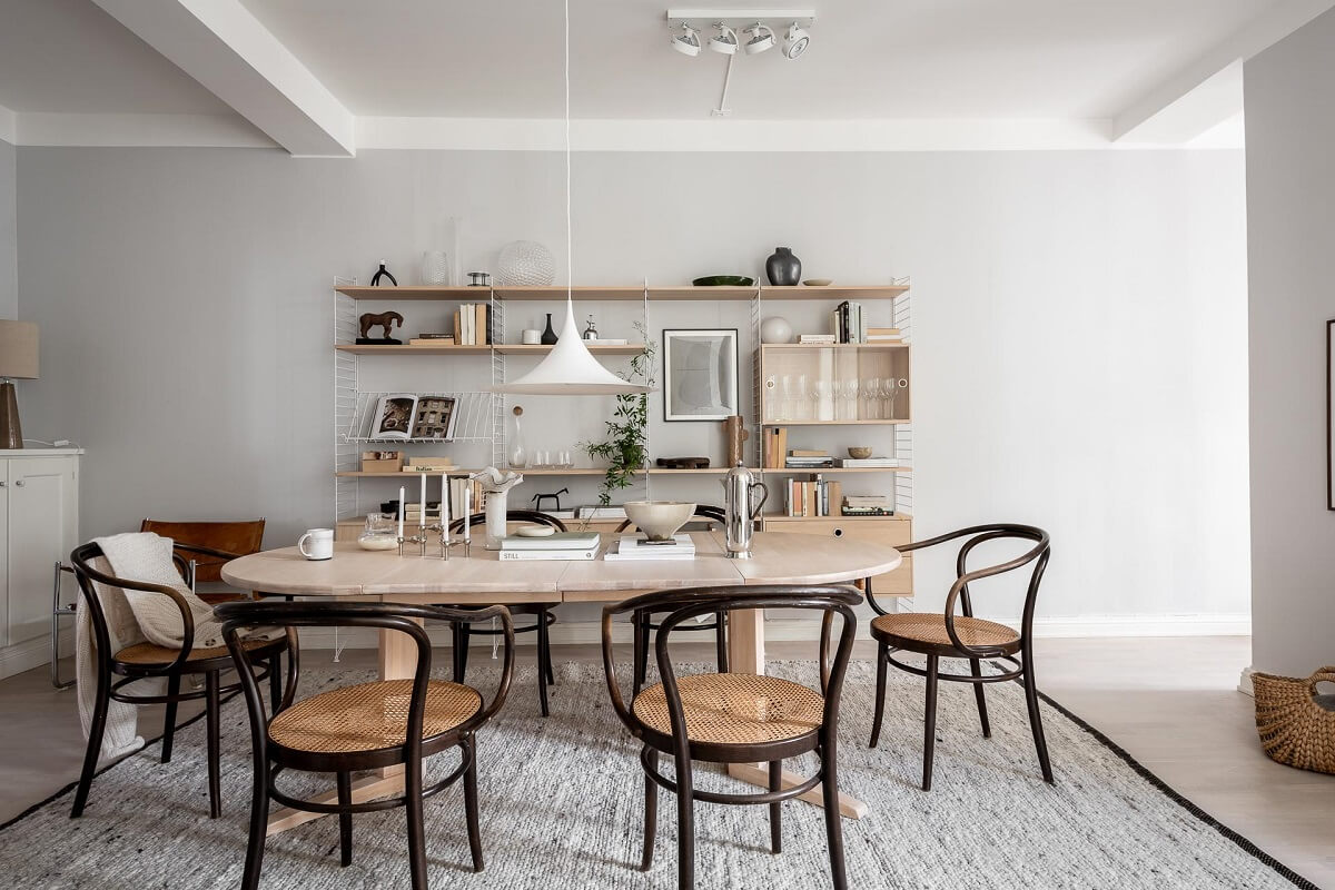 A Stylish Light Gray Swedish Apartment 6 scandi dining room with shelves