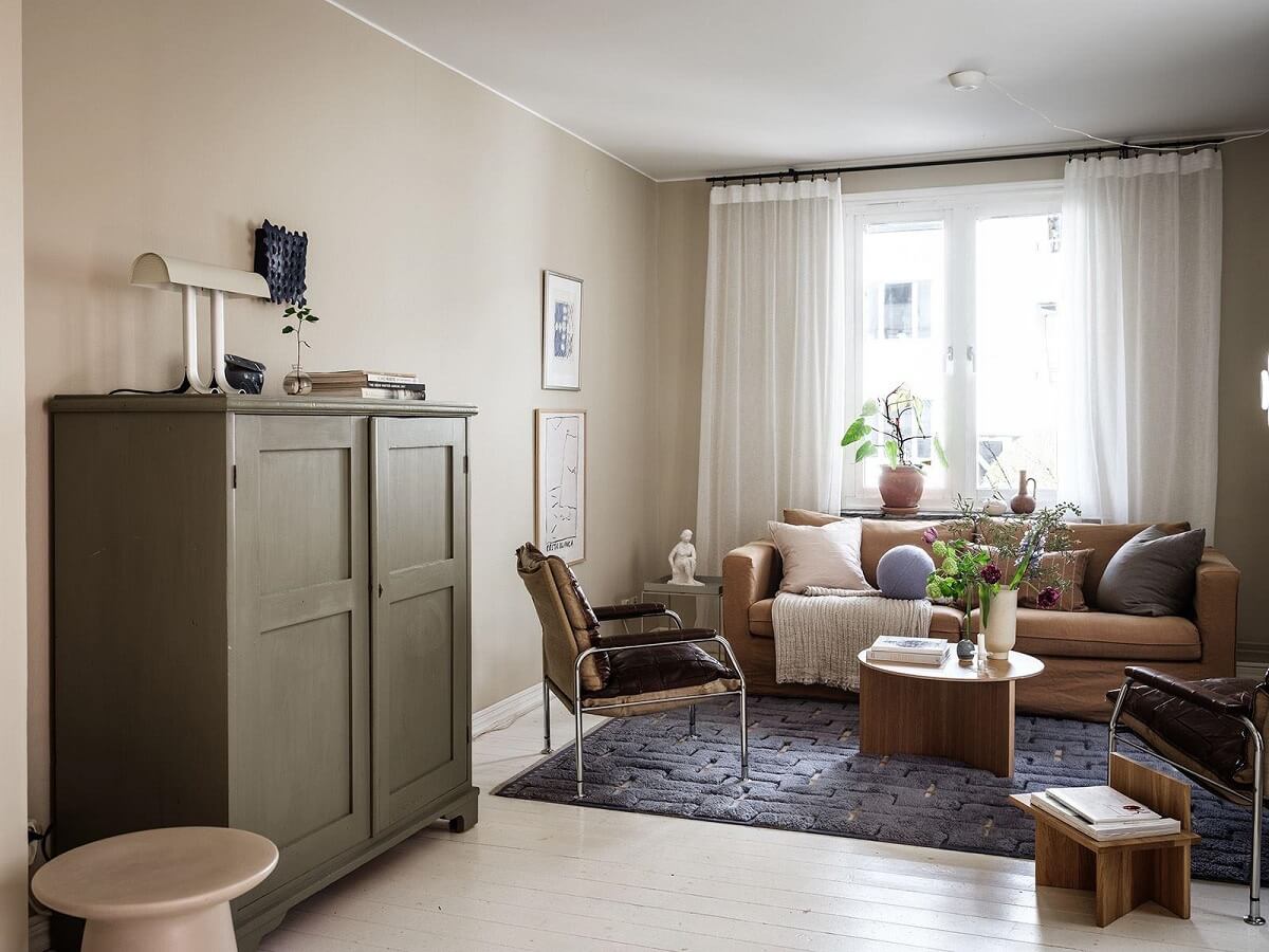 A Scandinavian Apartment with a Rust Red Bedroom 2 serene living room