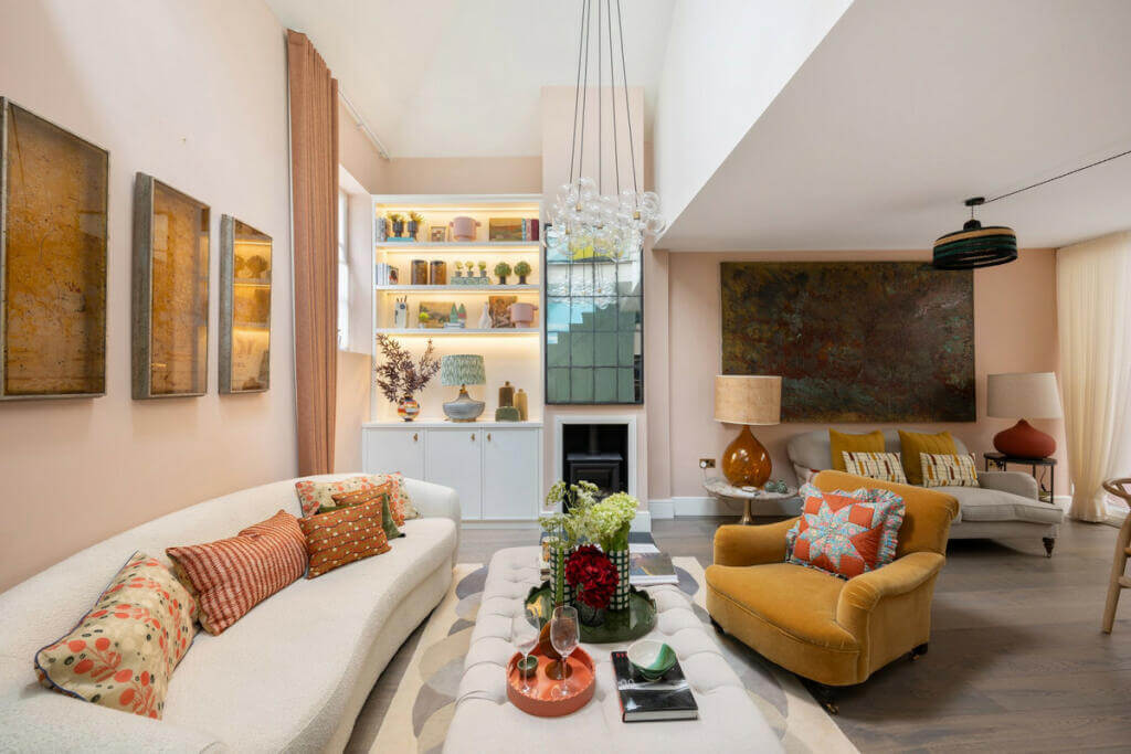 A Light London Maisonette in a Former Artist's Studio 2 sitting room with high ceilings and ochre yellow sofa