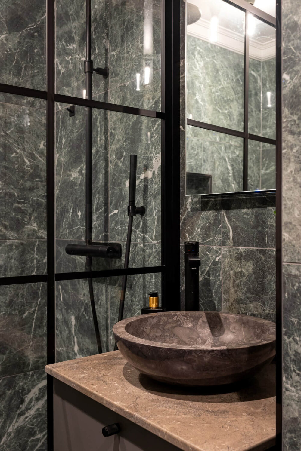 A Gray Apartment with an Industrial Glass Bedroom 18 small gray bathrorom with industrial shower wall