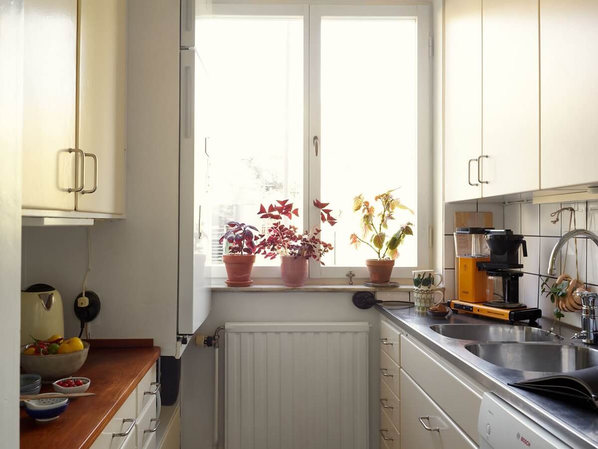 A Swedish Apartment with a Tiny Terracotta Brown Bedroom 11 small kitchen