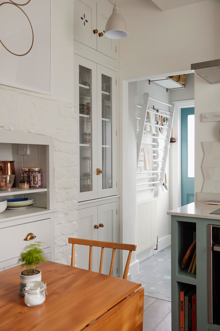 A London Maisonette with A Light Blue deVOL Kitchen 3 small wooden table and built in cabinets in kitchen