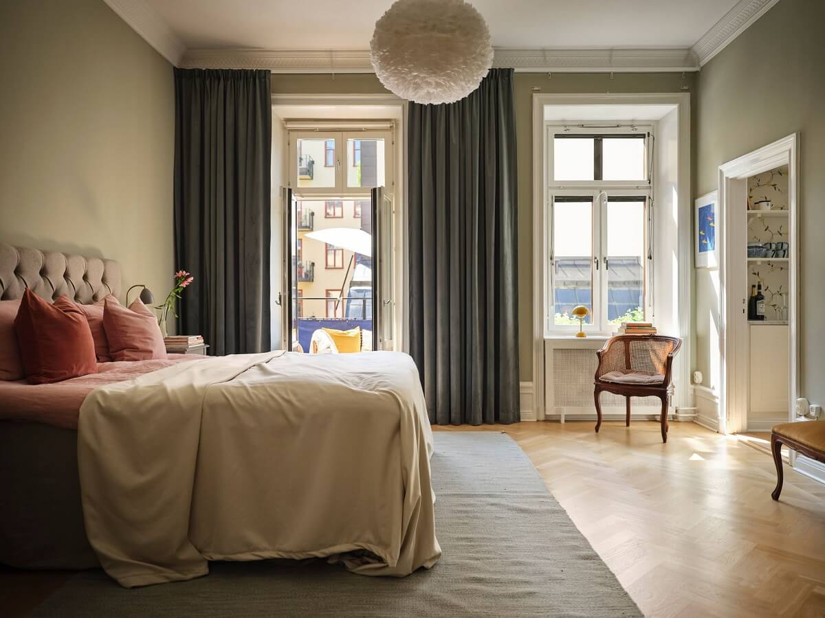 A Classic Stockholm Apartment with Floral Wallpaper 18 spacious bedroom with gray green walls and balcony nordroom
