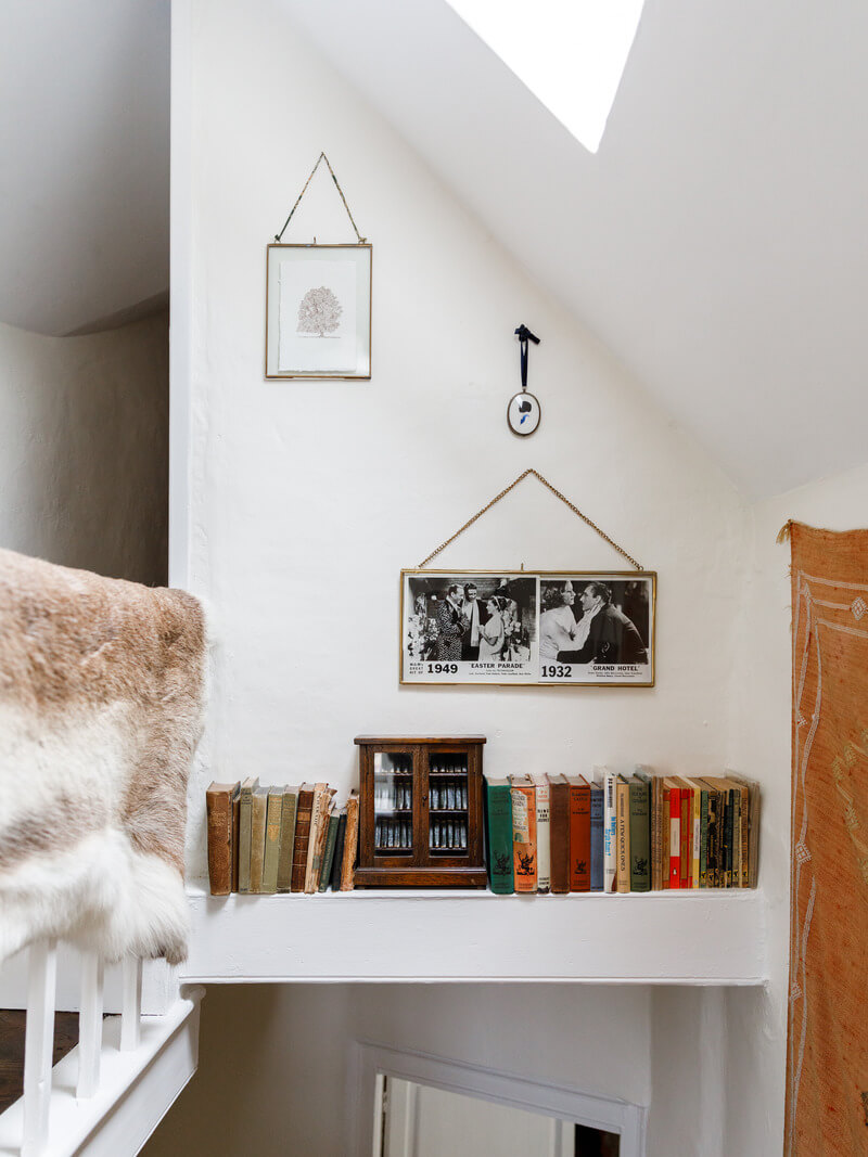 A Charming English Cottage Filled with Historic Character 18 staircase bookshelf