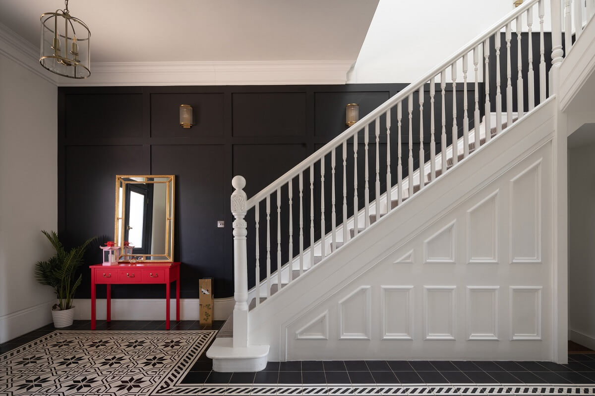 A Colorful London Family Home Renovated by Fraher & Finlay 21 staircase with black accent wall