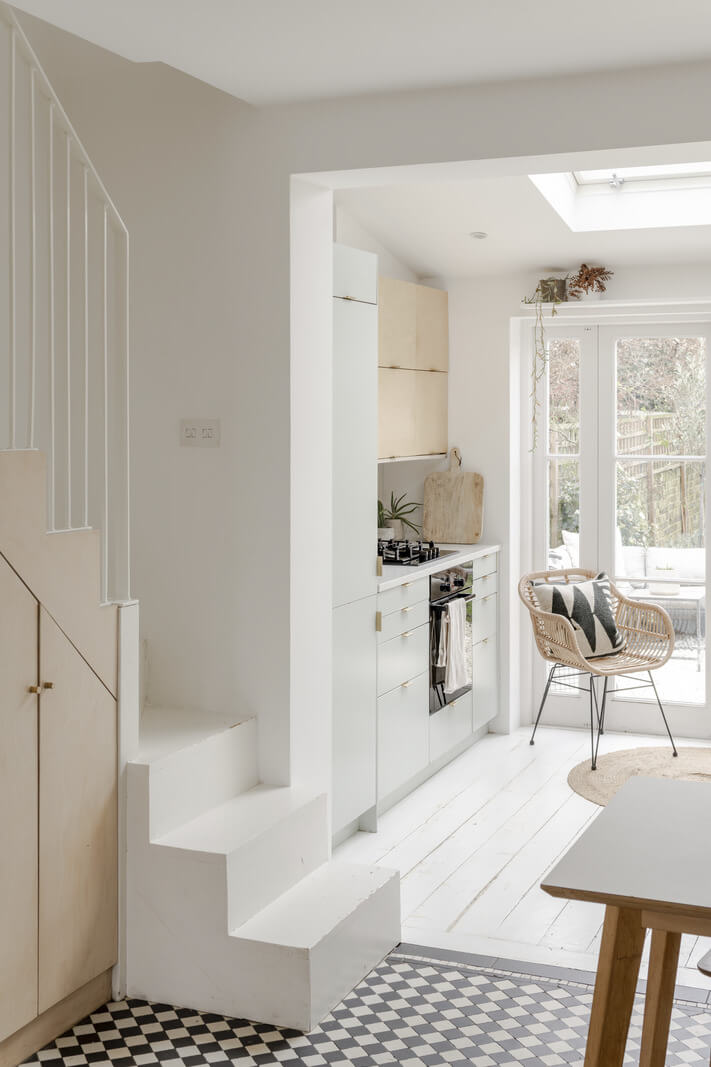 Light and Modern Spaces in a Small Victorian House 12 staircase with black and white tiles