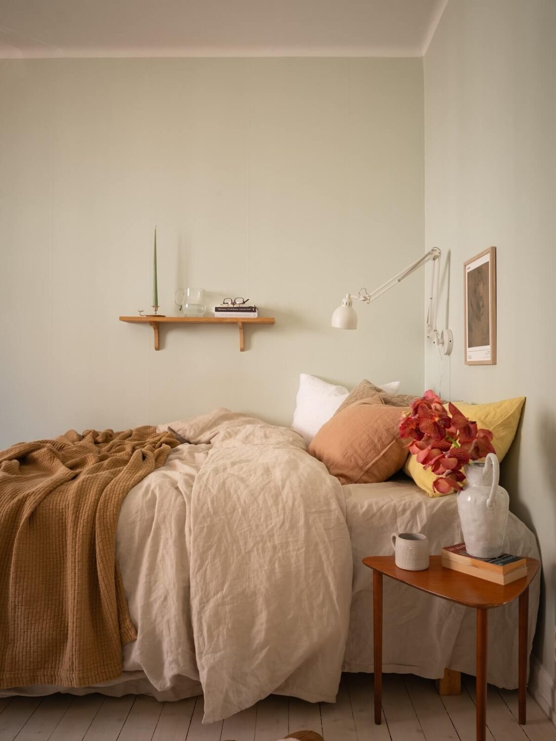 Calm Color Tones in a Light Scandinavian Studio Apartment 7 studio apartment bed area with shelf