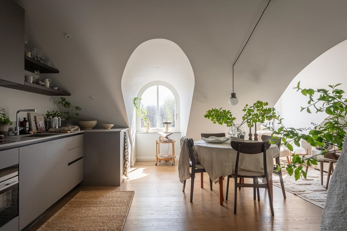 An Attic Studio Apartment with a Glass Room Divider 12 studio apartment kitchen dining space