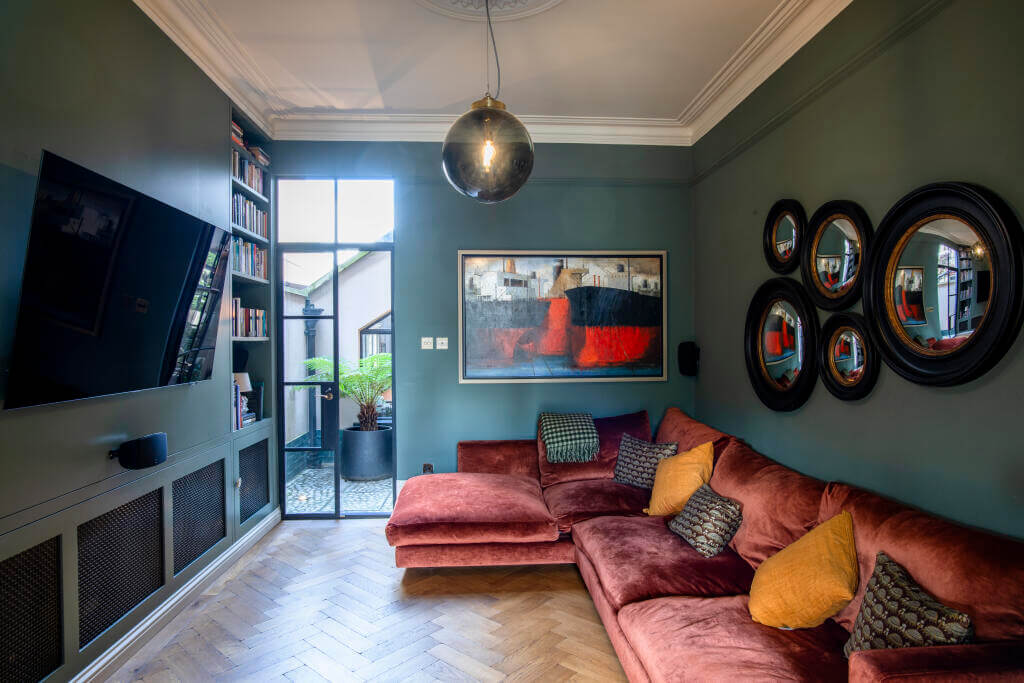 A Victorian House where the Kitchen is the Heart of the Home 7 television room with green walls
