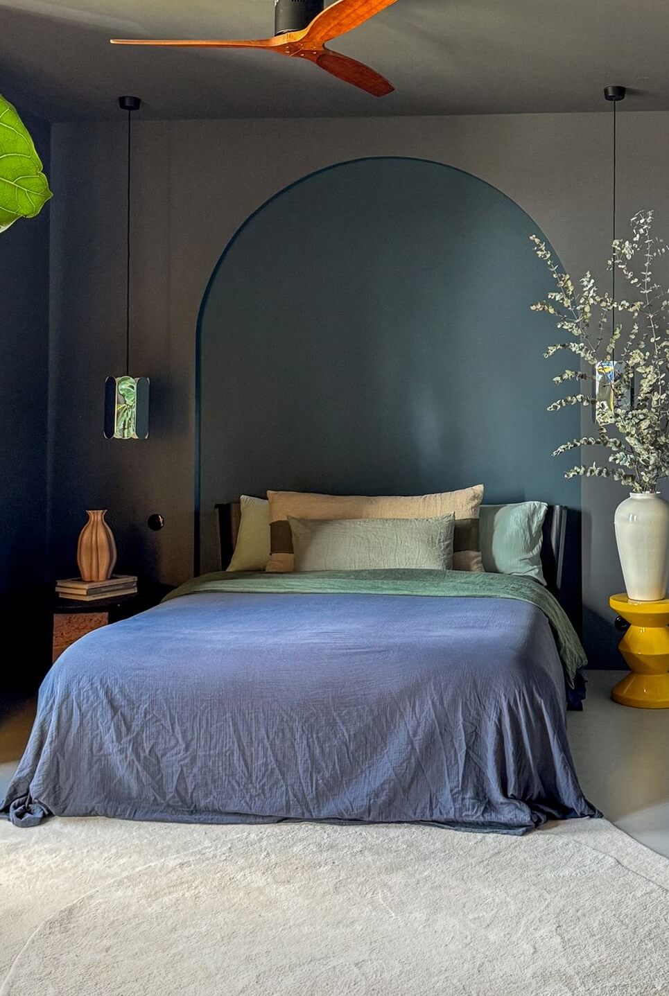 Color and Graphic Design in the Home of a Dutch Interior Stylist 24 two tone wall bedroom with arch