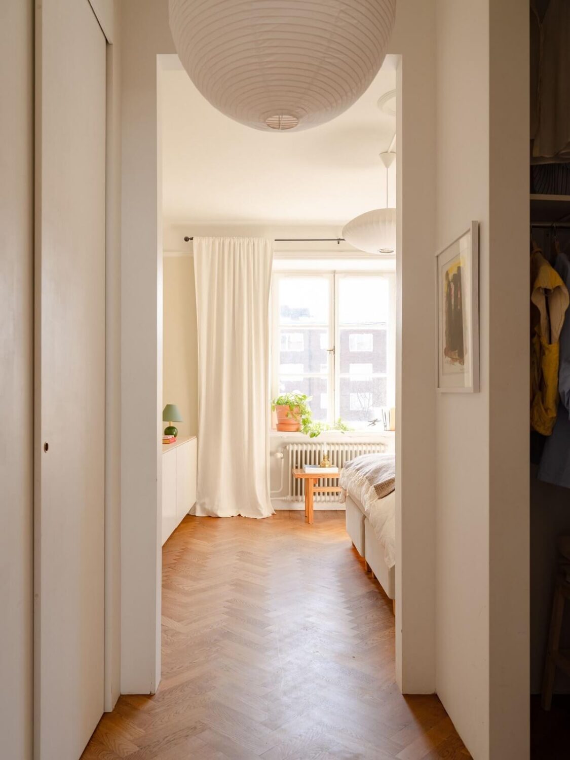 A Stockholm Apartment with Bright Green Color Accents 11 view into bedroom