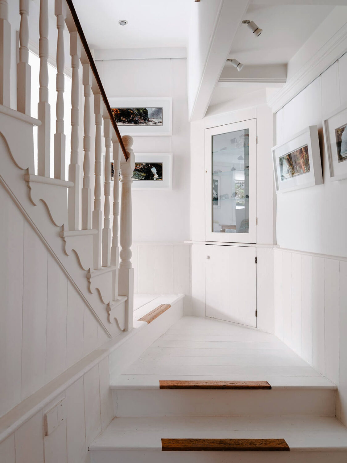 A Coastal White Painter's Home with Reclaimed Features in Cornwall 20 white staircase