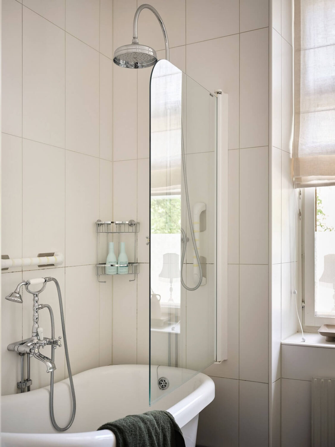 A Classic Stockholm Apartment with Floral Wallpaper 29 white bathroom with bath nordroom