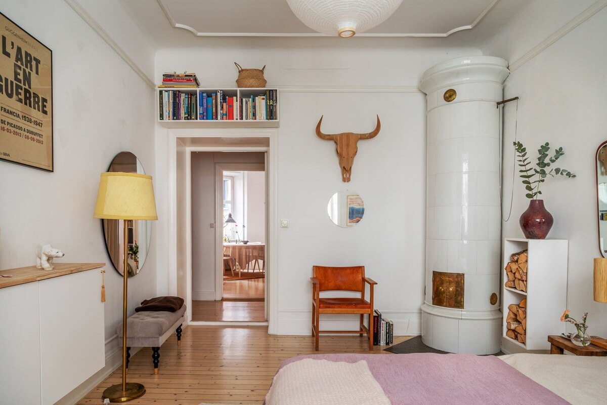 Period Details and Light Rooms in a Scandinavian Apartment 15 white bedroom with fireplace