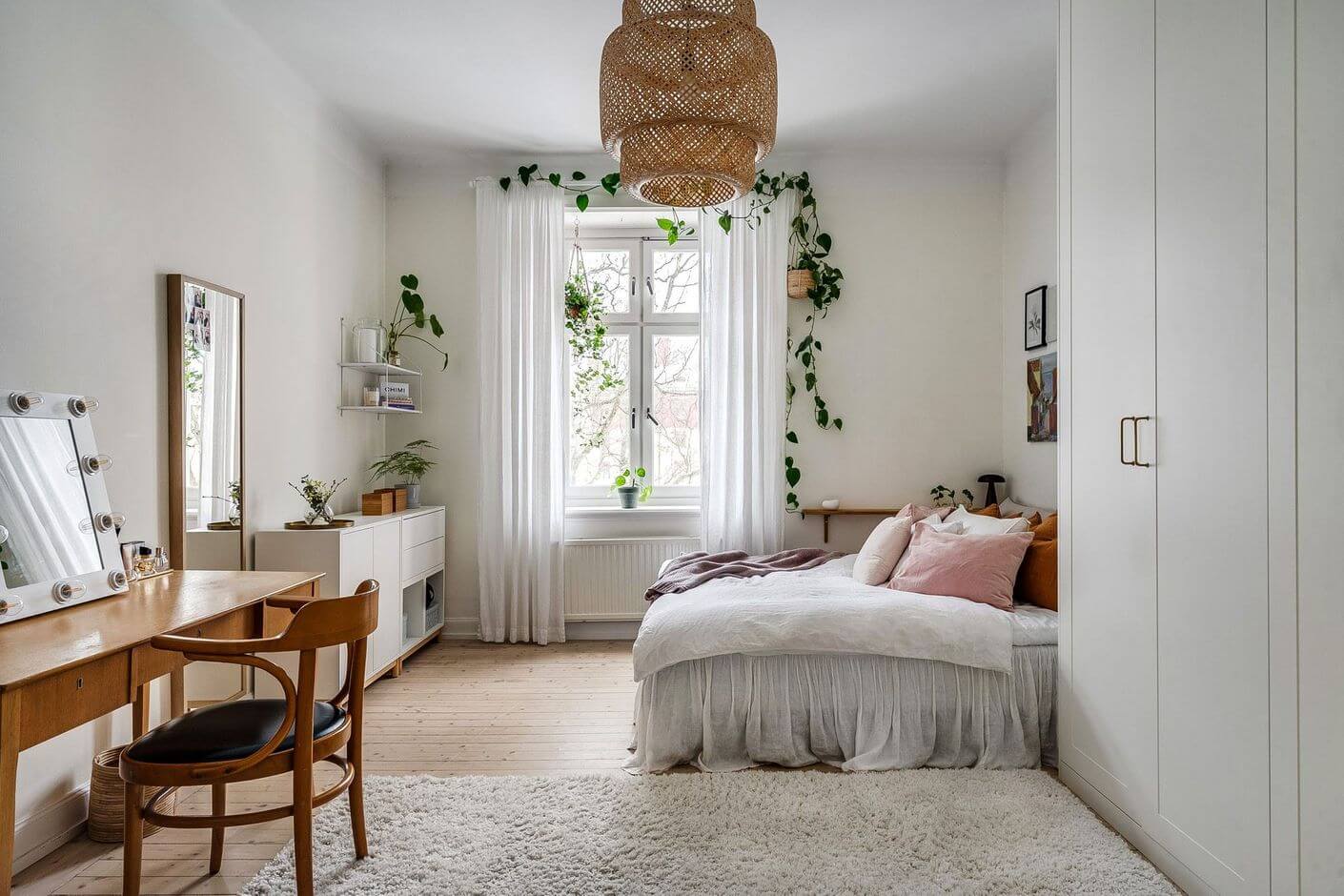 A Swedish Family Apartment with a Butter Yellow Kitchen 17 white bedroom with wardrobes