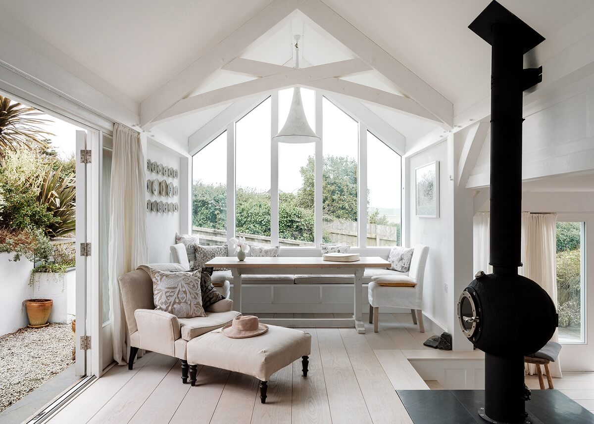 white dining space with bench and pitched ceiling nordroom