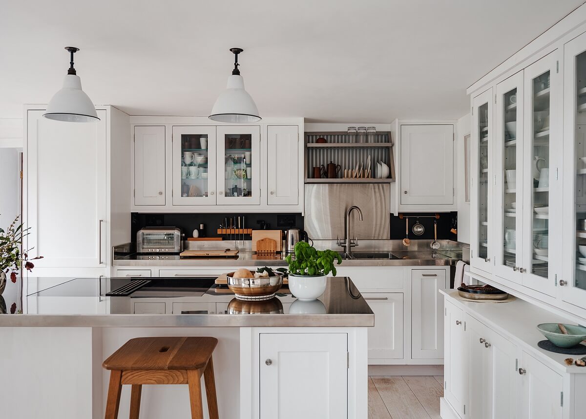 A Coastal White Painter's Home with Reclaimed Features in Cornwall 4 white kitchen with bar seating