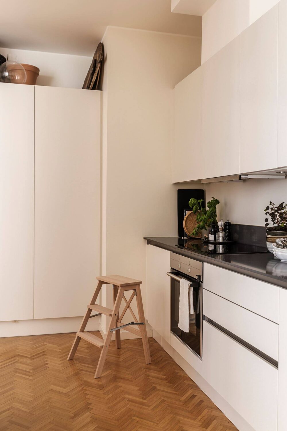 A Serene Modern Home in a Former Factory Building 8 white kitchen wooden floor