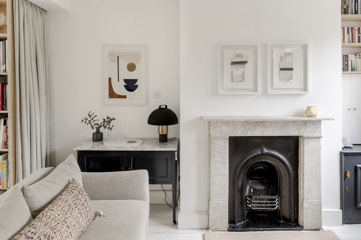 Light and Modern Spaces in a Small Victorian House 3 white liivng room with fireplace and black accents