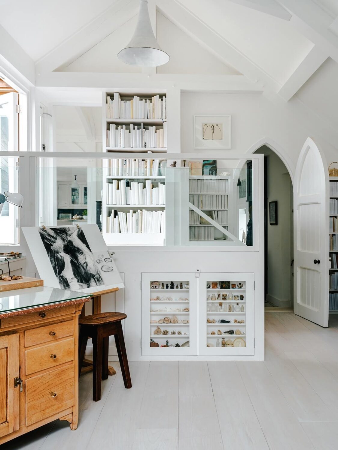 A Coastal White Painter's Home with Reclaimed Features in Cornwall 7 white-living-space-with-bookcase
