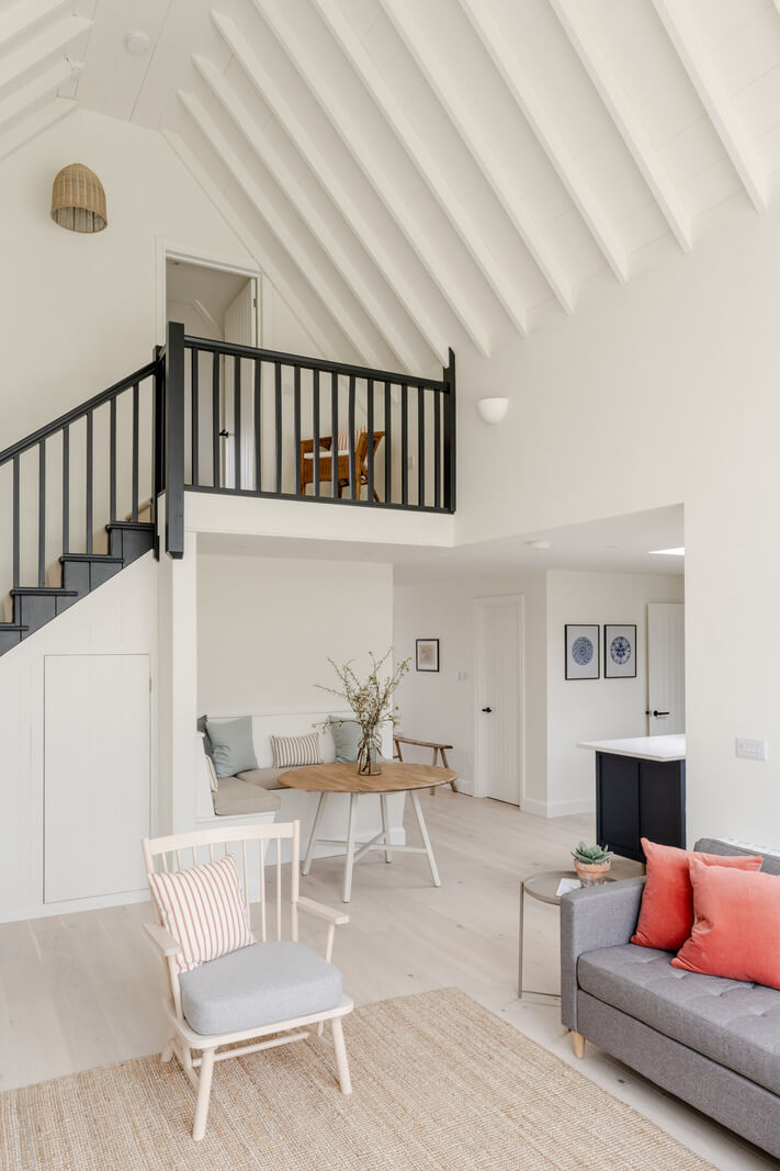A Modern Barn House in the English Countryside 9 white open plan living space with pitched ceiling