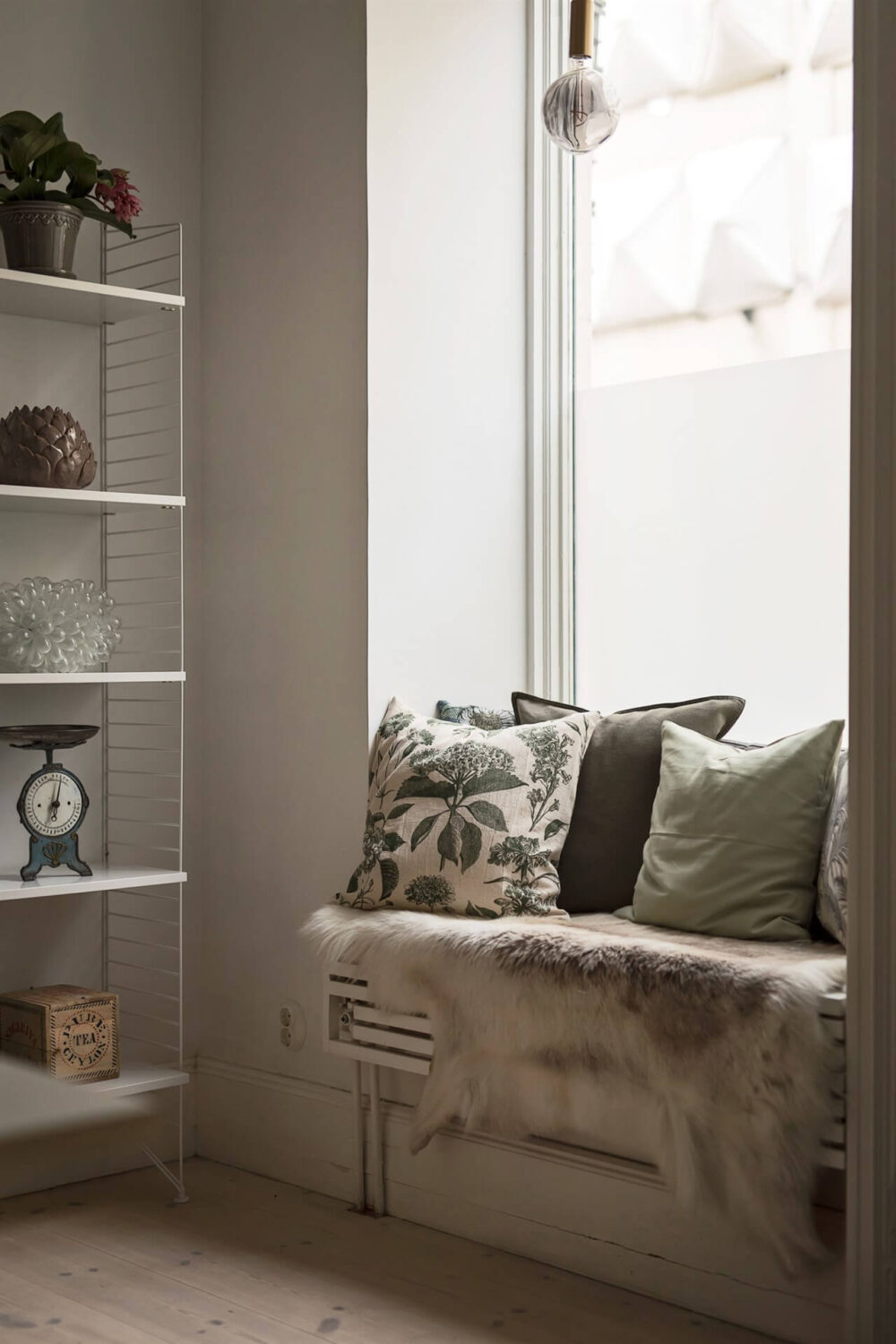 A Swedish Apartment with an Exposed Brick Wall 6 window seat