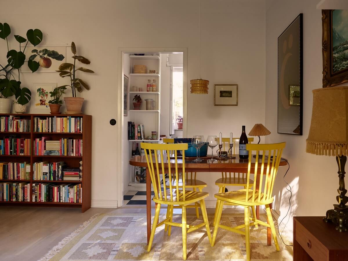 A Swedish Apartment with a Tiny Terracotta Brown Bedroom 8 yellow dining chairs