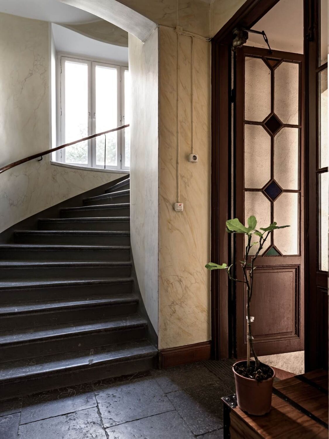 Light Rooms in a Renovated Historic Apartment in Stockholm 24 apartment building hall and spiral staircase nordroom