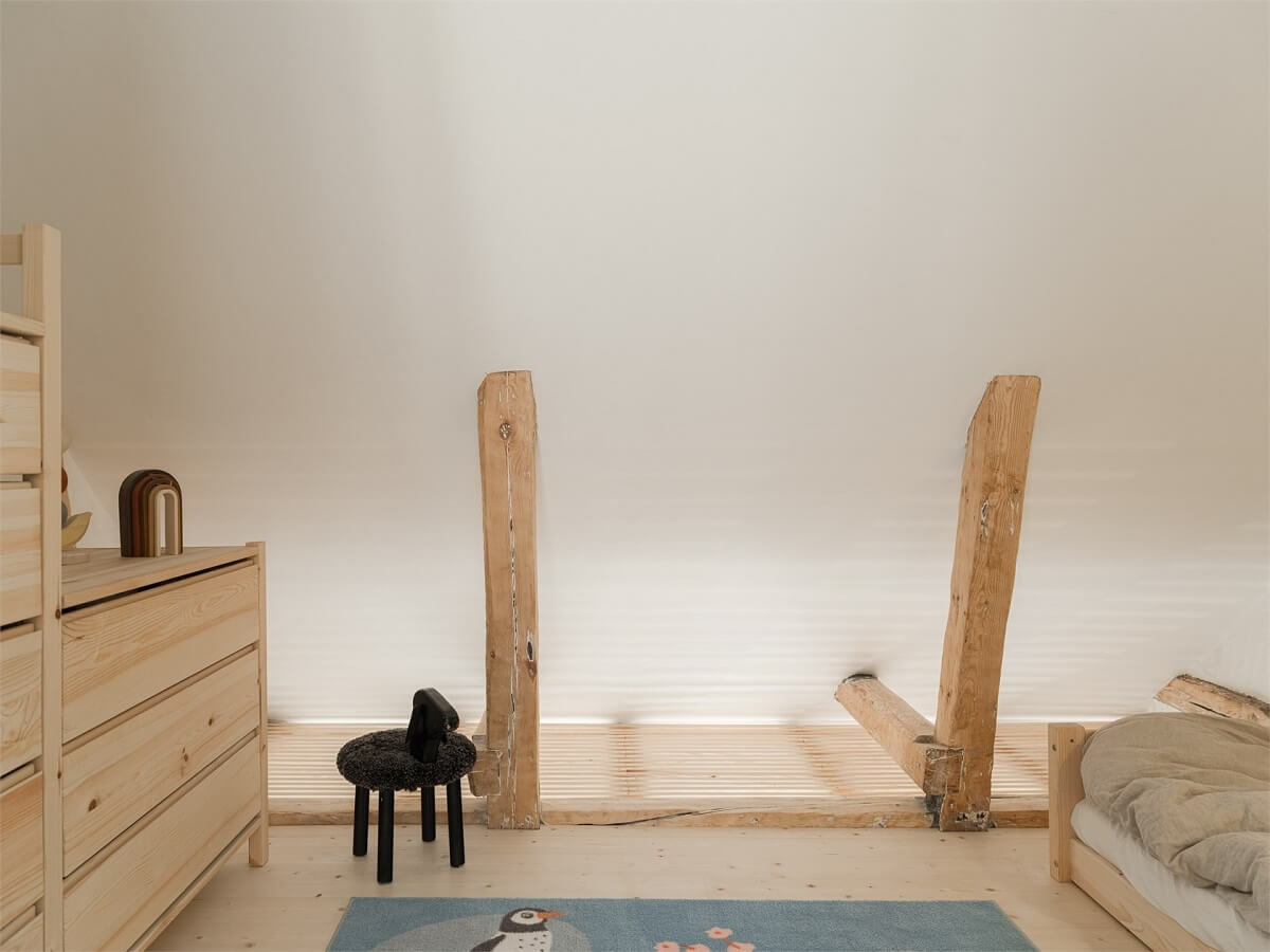 Wooden Details in a Light Duplex Apartment in Sweden 19 attic bedroom wooden beams