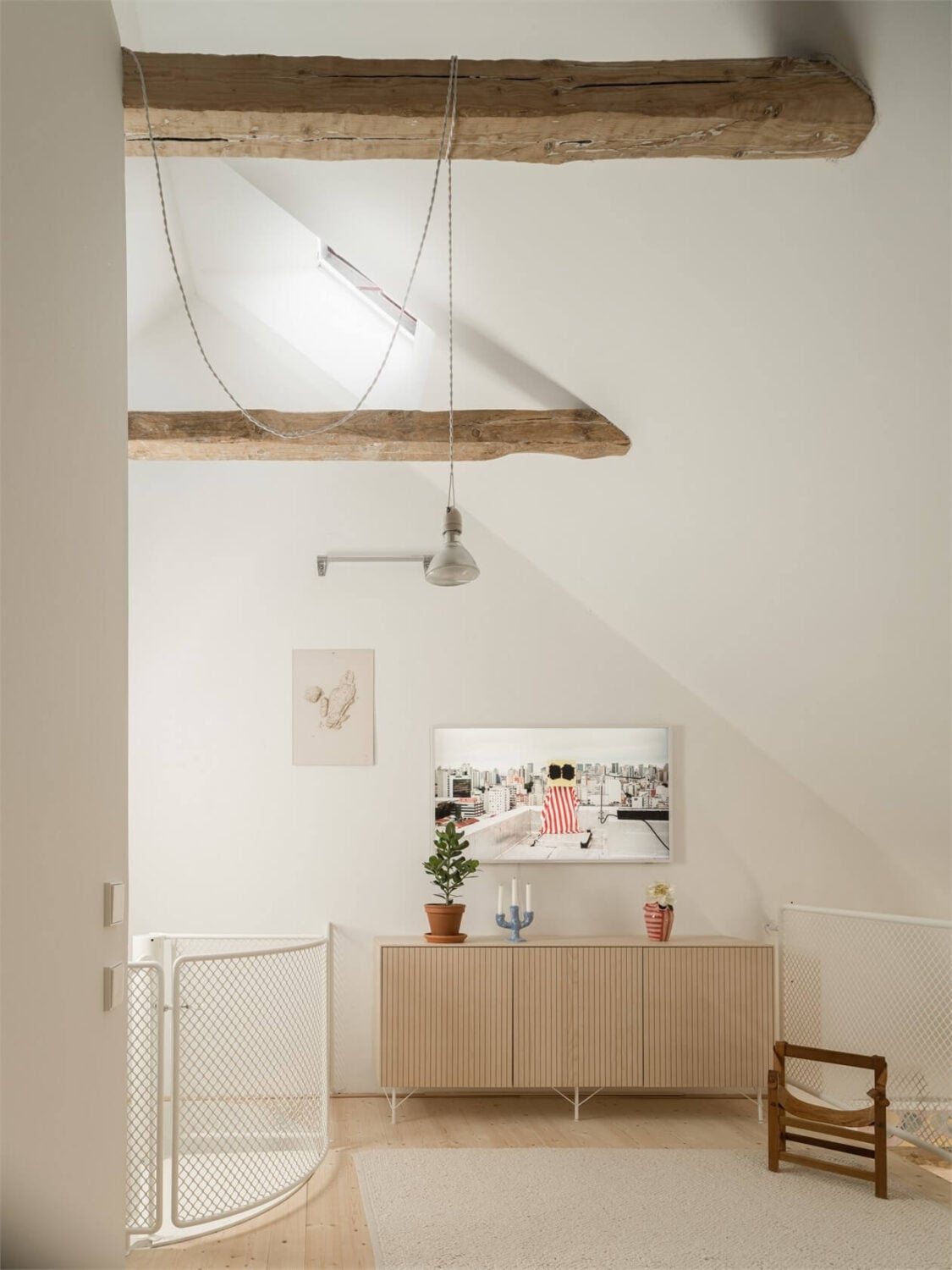 Wooden Details in a Light Duplex Apartment in Sweden 17 attic floor with wooden beams