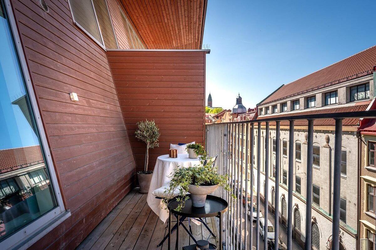 Floor-to-Ceiling Bookcases and Windows in a Loft Style Apartment 8 balcony