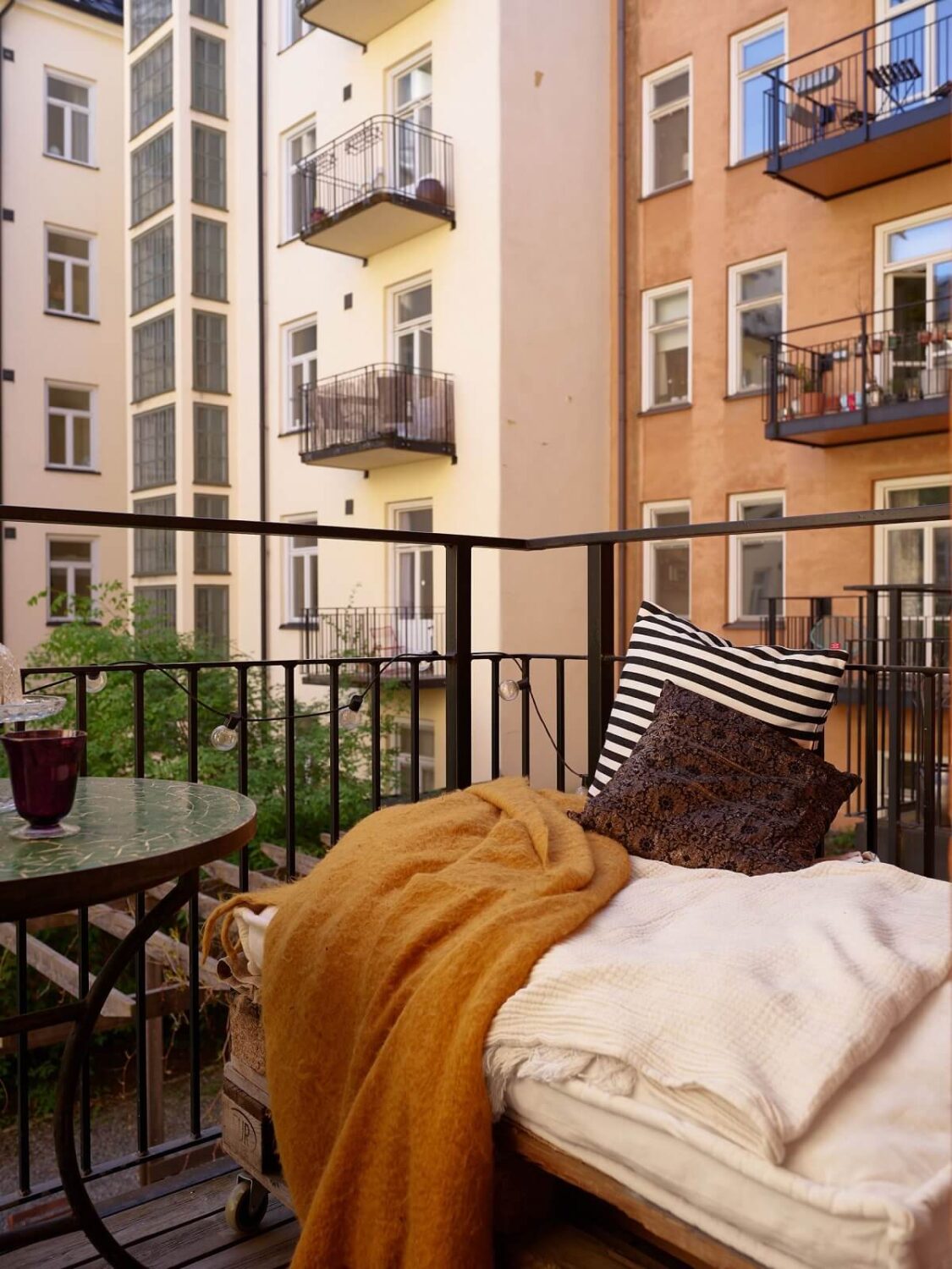 Warm Tones and a Blue Hallway in a Stockholm Apartment 19 balcony seating