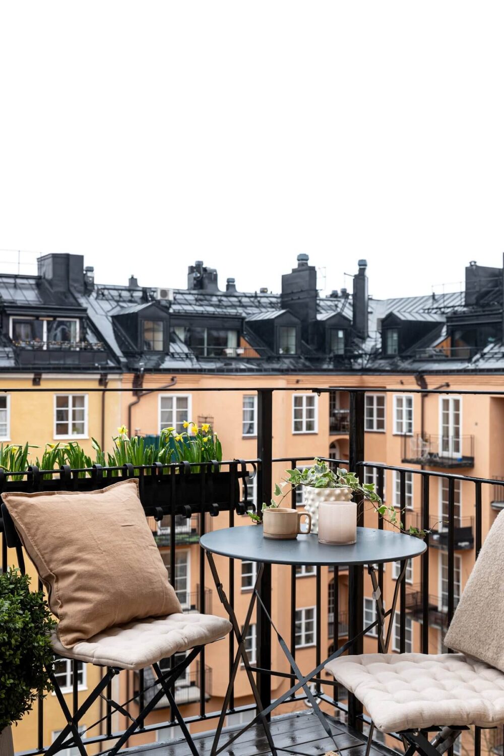 A Stylish Renovated Stockholm Apartment with Built-In Storage 16 balcony with bistro table
