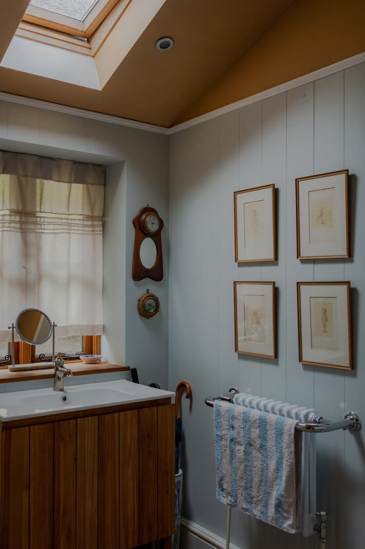 Ochre Yellow and Green Tones in a Cozy Welsh Cottage 23 bathroom light blue walls skylight nordroom