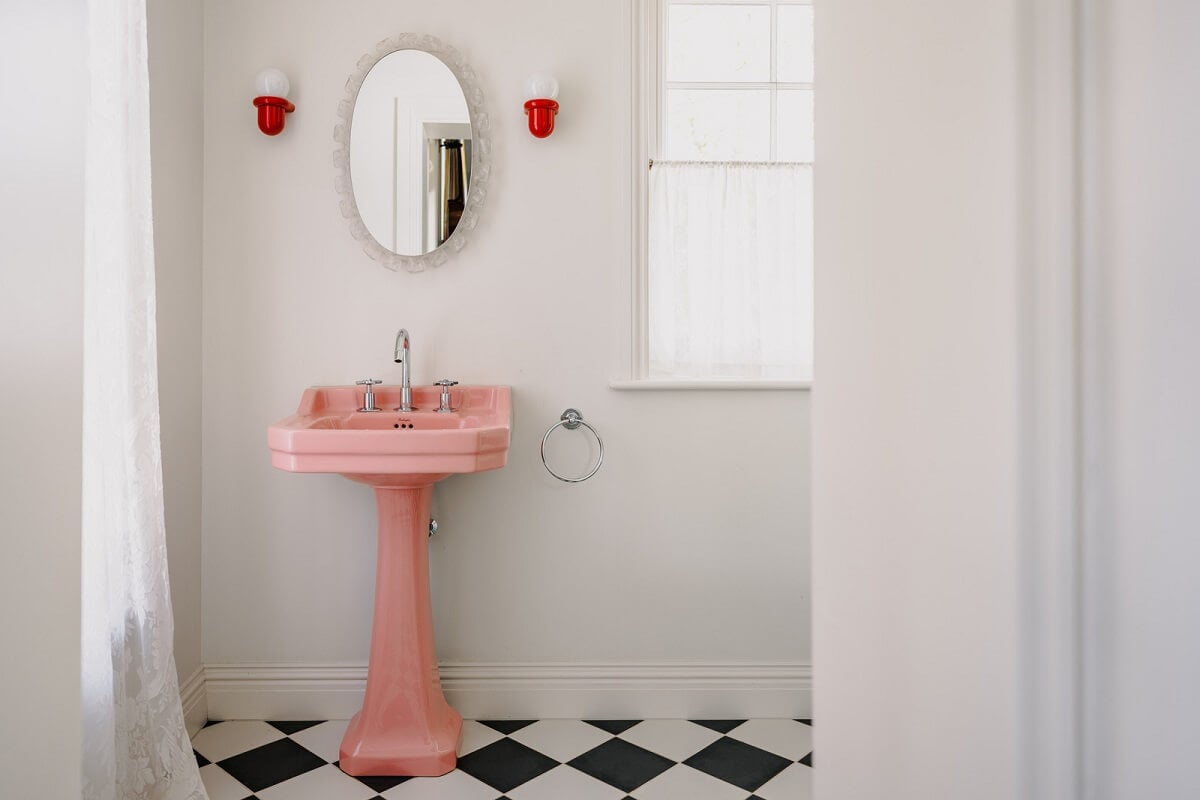 A White English House with a Beautiful Open-Plan Kitchen 21 bathroom pink sink