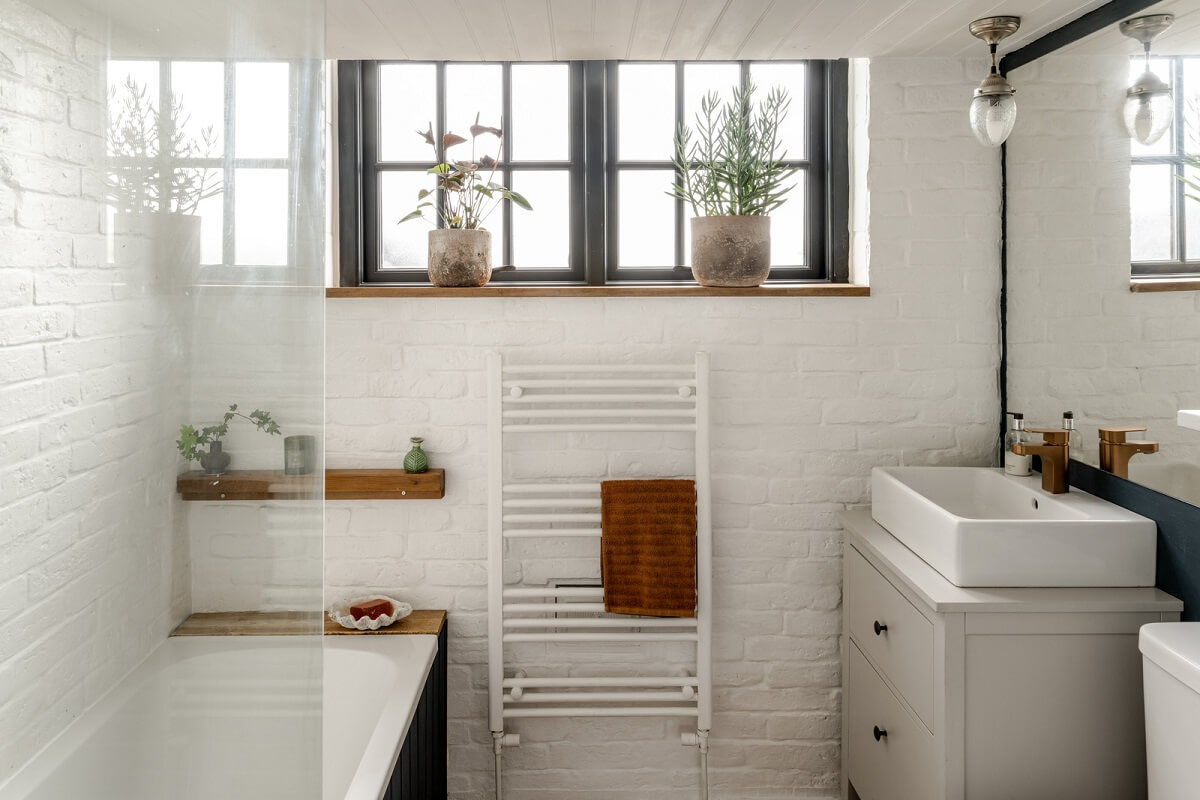 A Tiny Off-Grid House in the English Countryside 7 bathroom-white-painted-brick-wall-nordroom